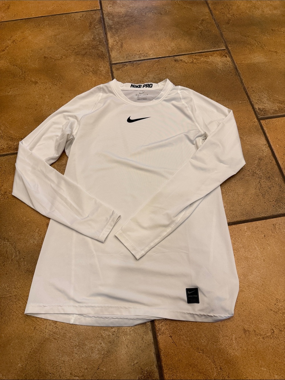 Nike White Long Sleeve Performance Top with Black Swoosh